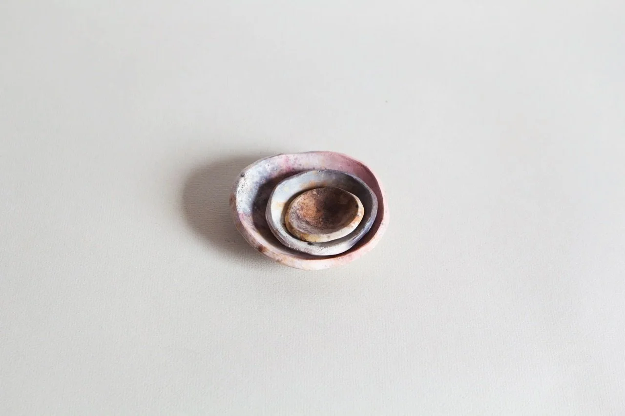 A little look at these special planet-like dishes

These little pinch pots carry the beautiful marks left by the pit fire &mdash; soft smoke blushes, flashes of colour, and surface markings unique to each piece. 

Ranging from approx 4&ndash;9 cm wid