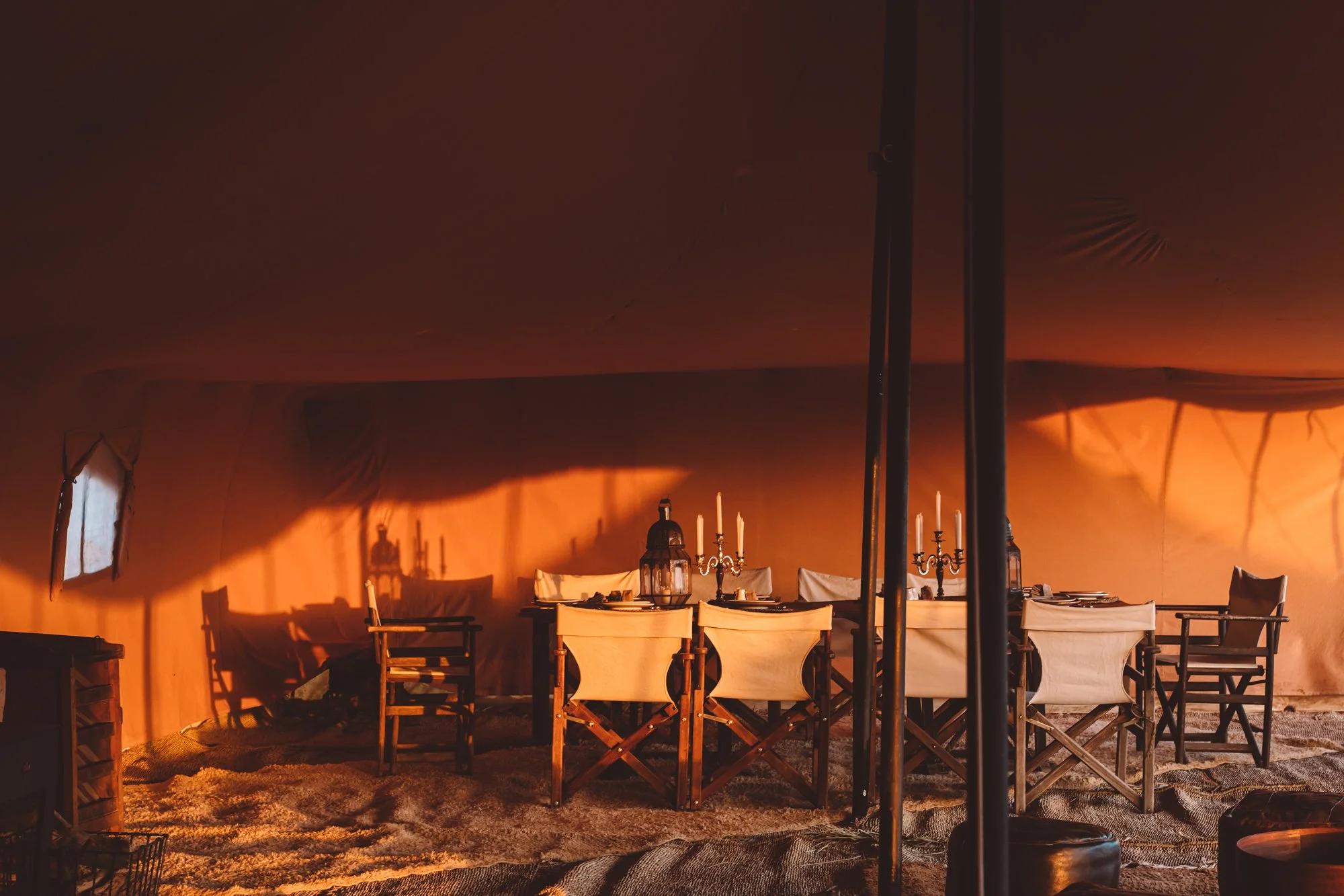 Minimal desert tents, handcrafted objects and golden dunes at Scarabeo Camp. Boutique travel photography by Sophia van den Hoek.
