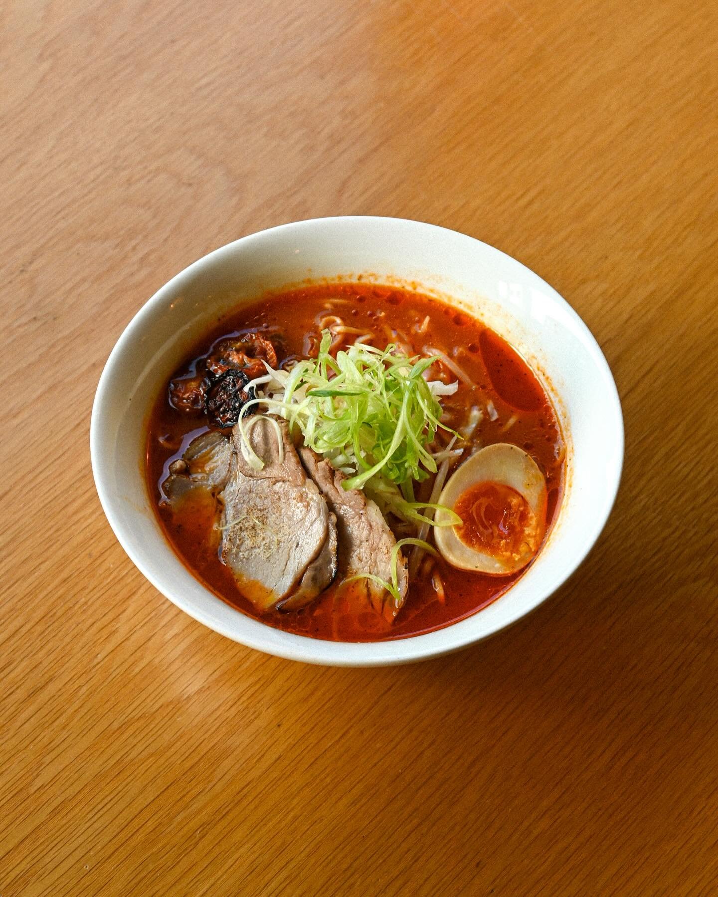 Braised Pork Collar &amp; Tomato Shio Ramen Special

Another lighter, shio tare flavoured with cherry tomatoes, added to the clear chicken broth, and topped with braised and torched pork collar, sun-dried tomatoes, beansprouts and marinated egg. A re