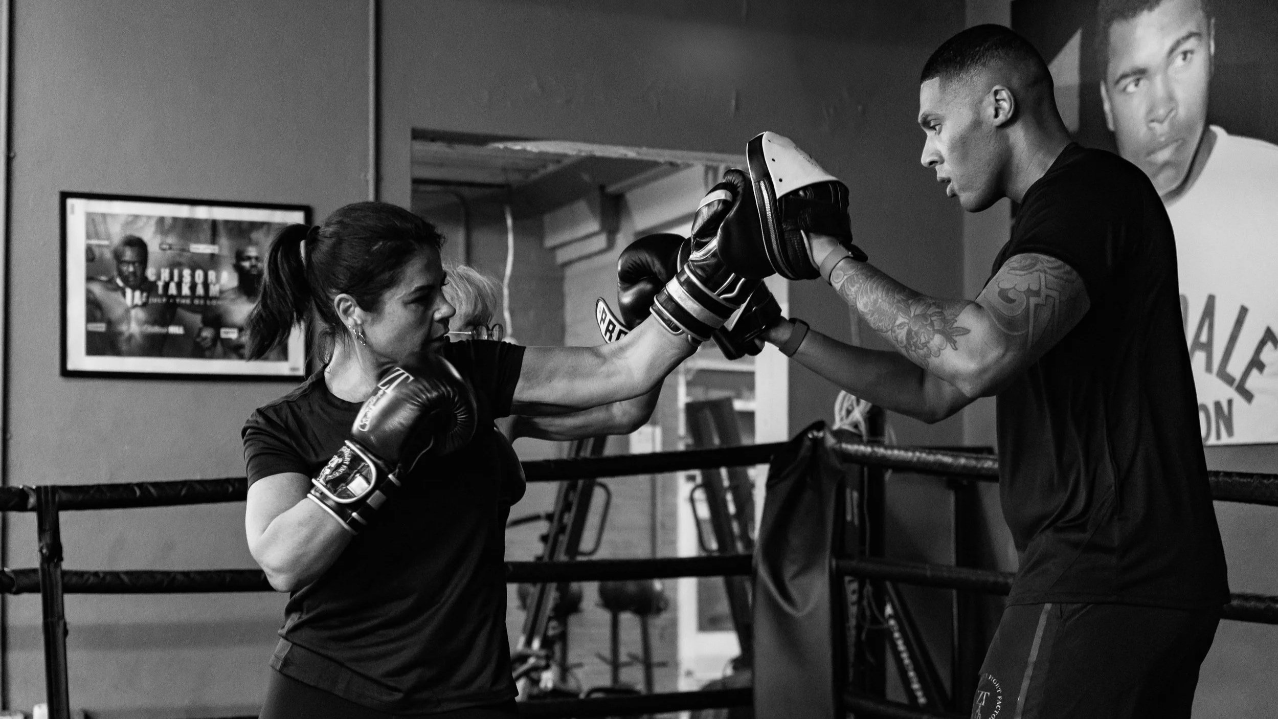 woman hitting pads in Finchley in a boxing club