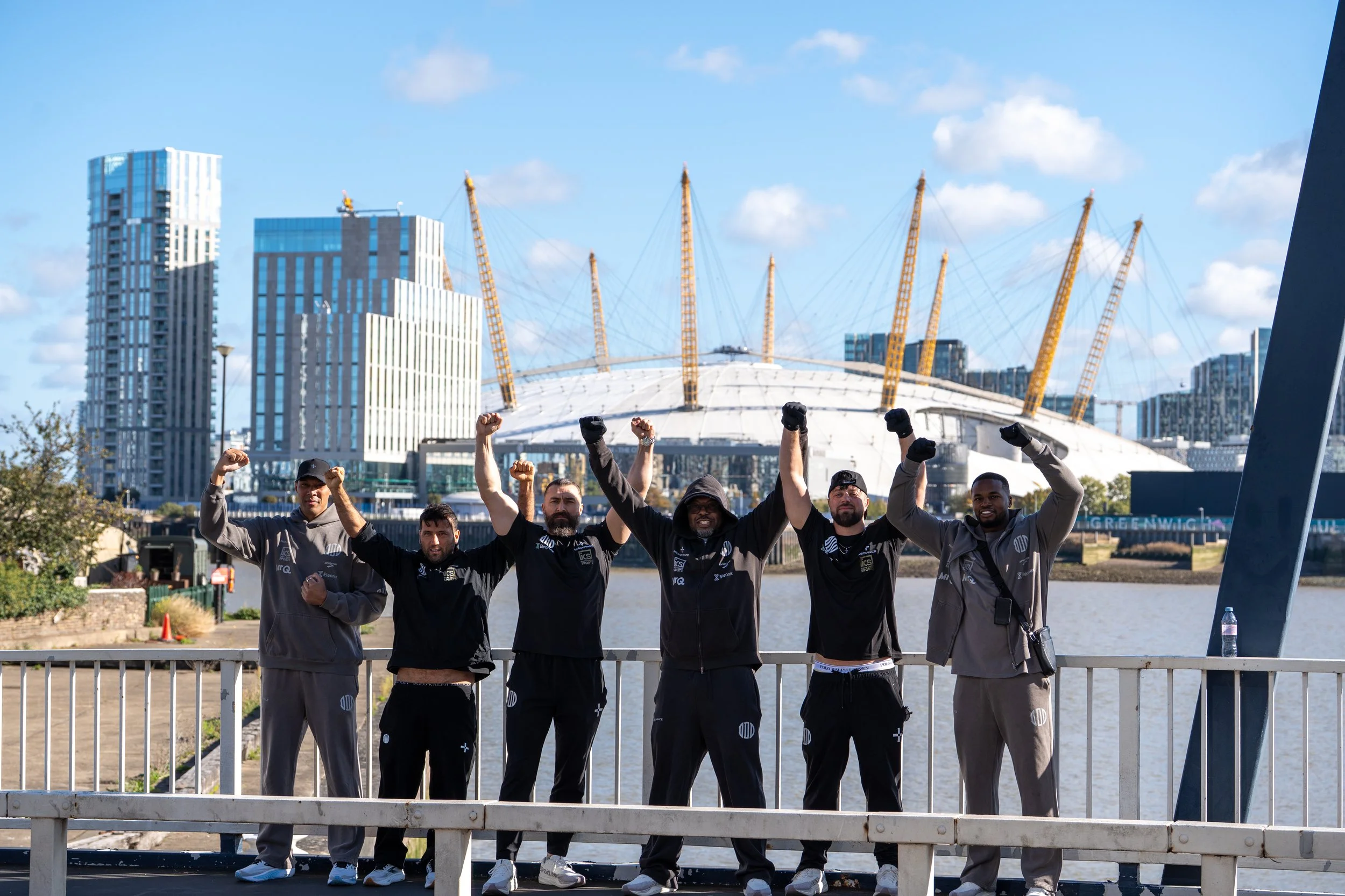 part of DDD team celebrating after the win with the o2 grenwhich in the background