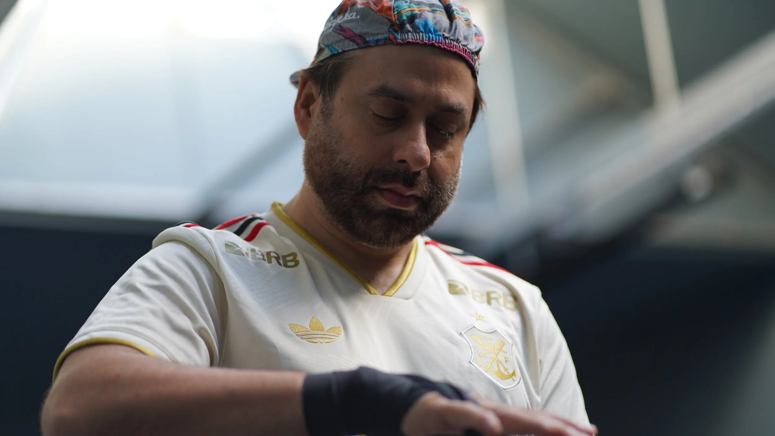 man wrapping his hands ready to box