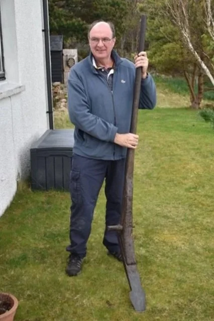With Johnny Ali Mackenzie's cas crom (foot plough) at Will Maclean's house in Polbain, 2024.
