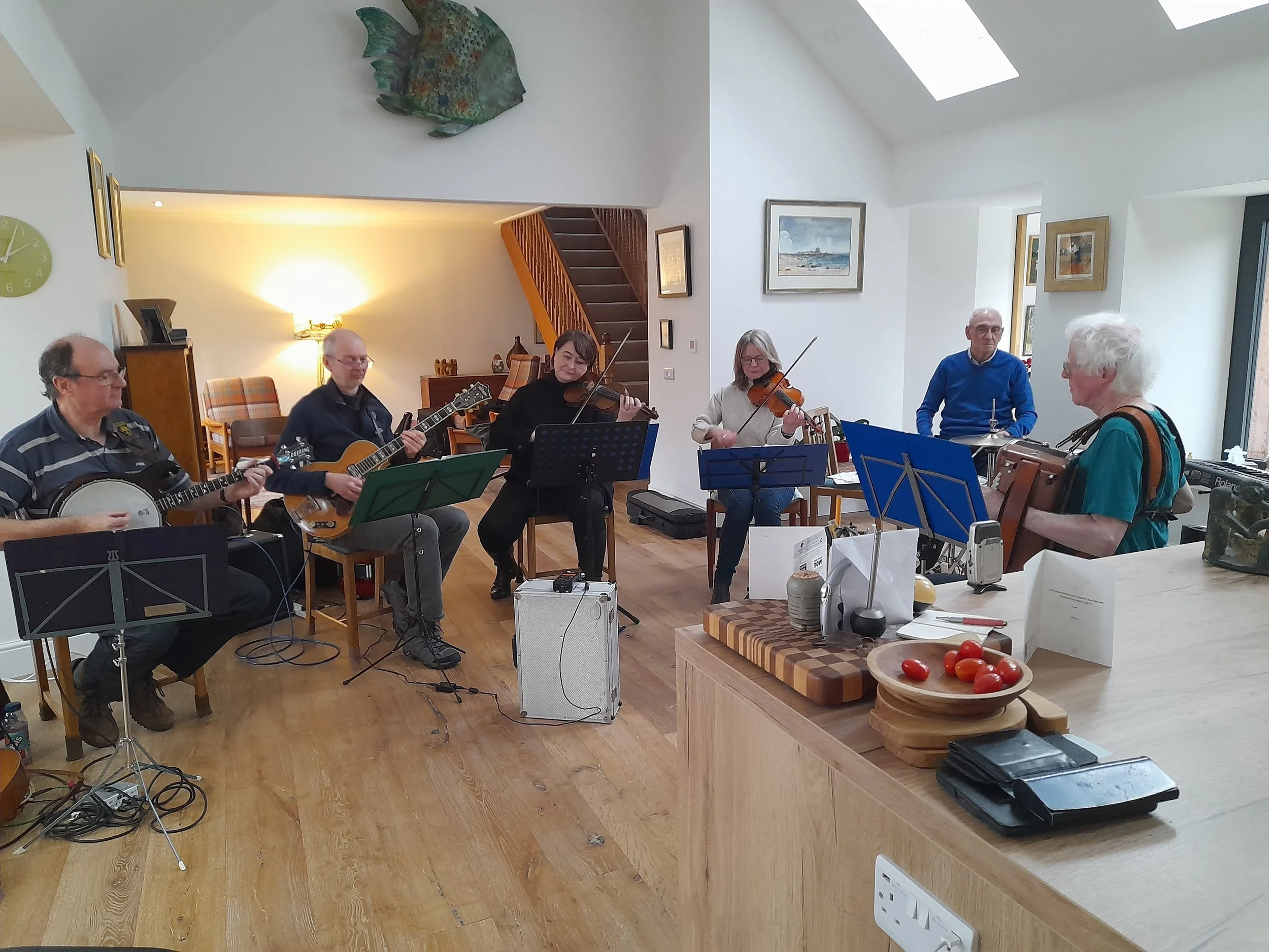The Occasionals rehearsing for BBC Radio Scotland's 'Take The Floor' broadcast. Kevin Macleod, Malcolm Jones, Angela MacEachern, Alison Smith, Gus Millar, Freeland Barbour & Neil MacMillan. 11th January 2026 at Butlaw Cottage.