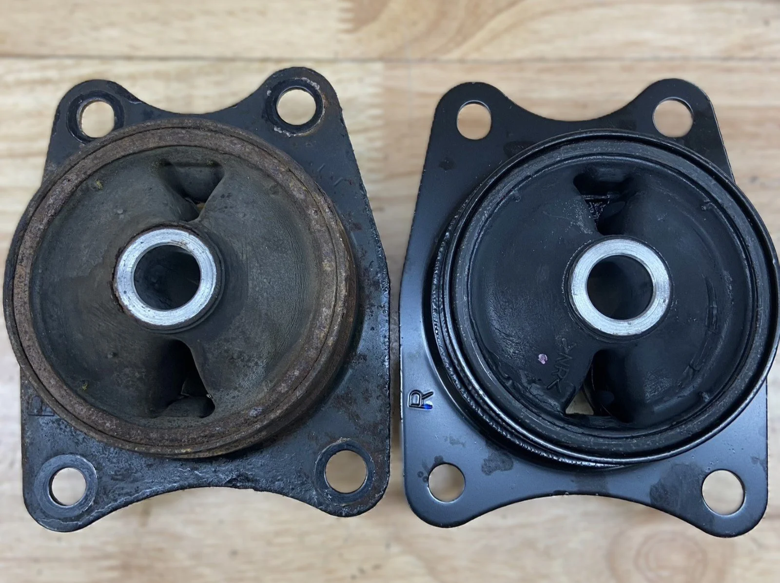  Original and replacement rear differential mounts for a Honda S2000 