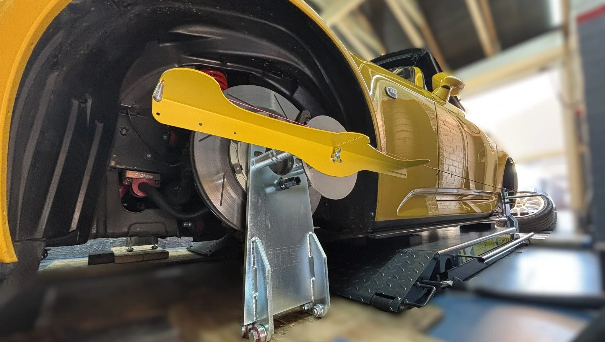 Our Honda S2000 being checked with a hub-mounted alignment system before the final wheel choice was made.