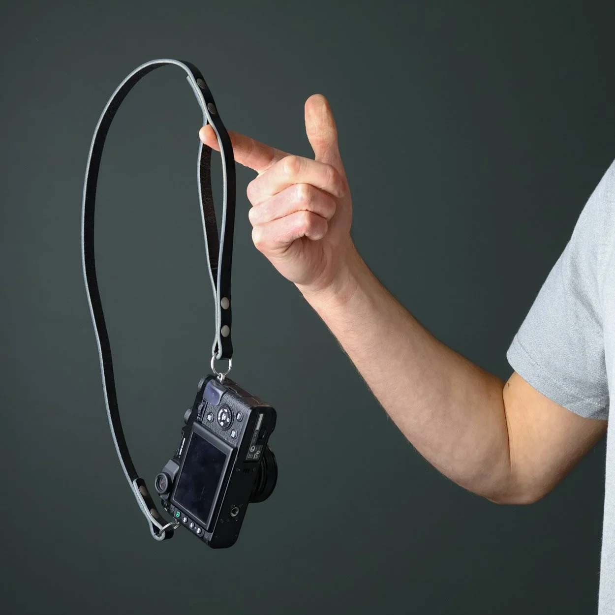 Peak leather neck shoulder strap doubles up as wrist strap. Handmade in the UK