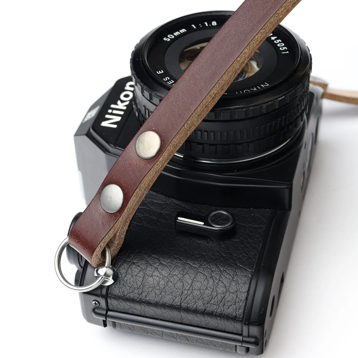 Peak chestnut closeup camera strap with Nikon camera