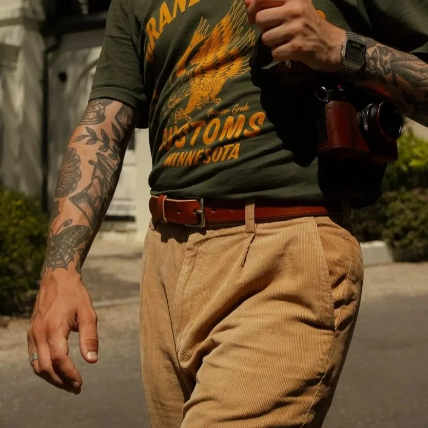brown leather belt with cord trousers