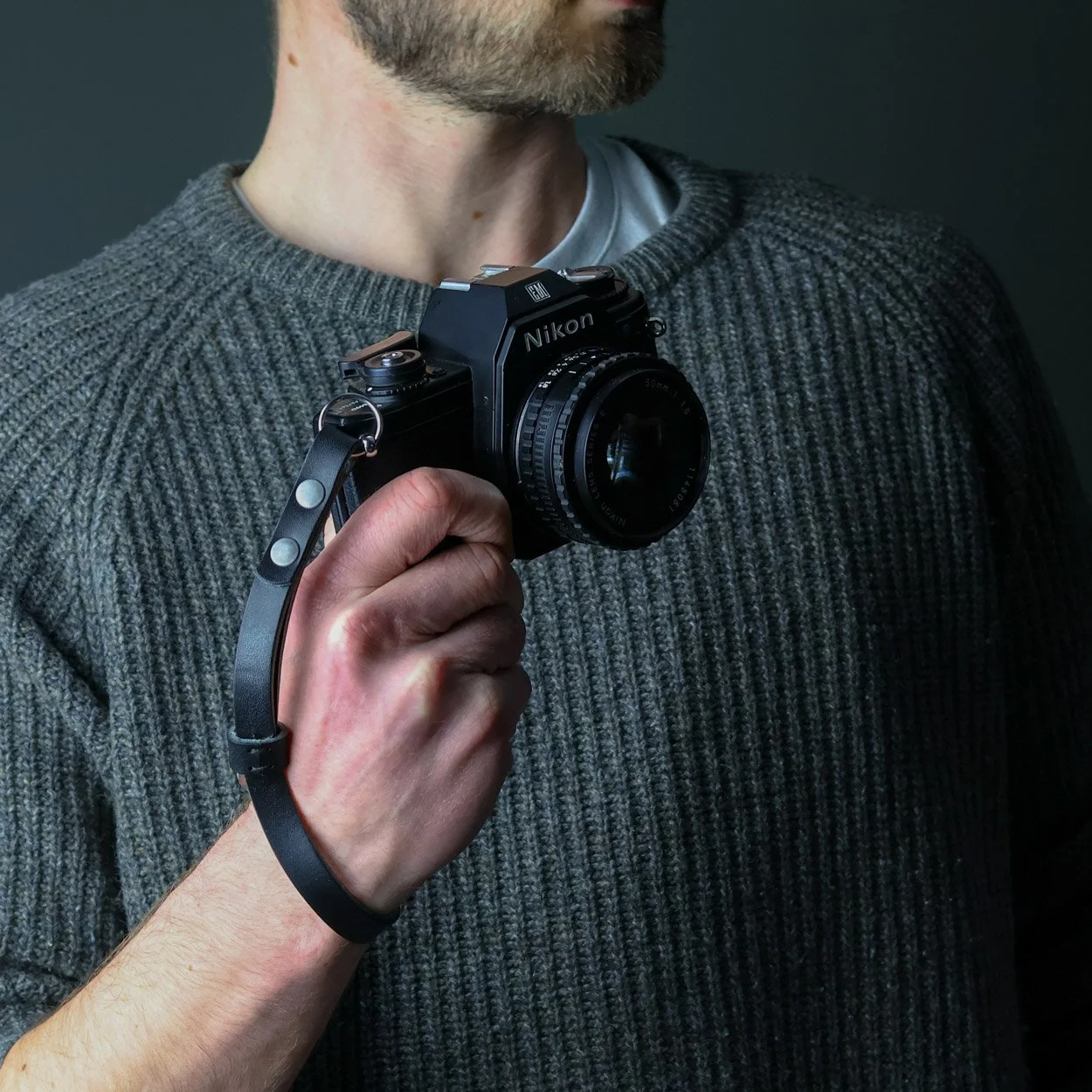Black Leather camera wrist strap with a vintage Nikon film camera
