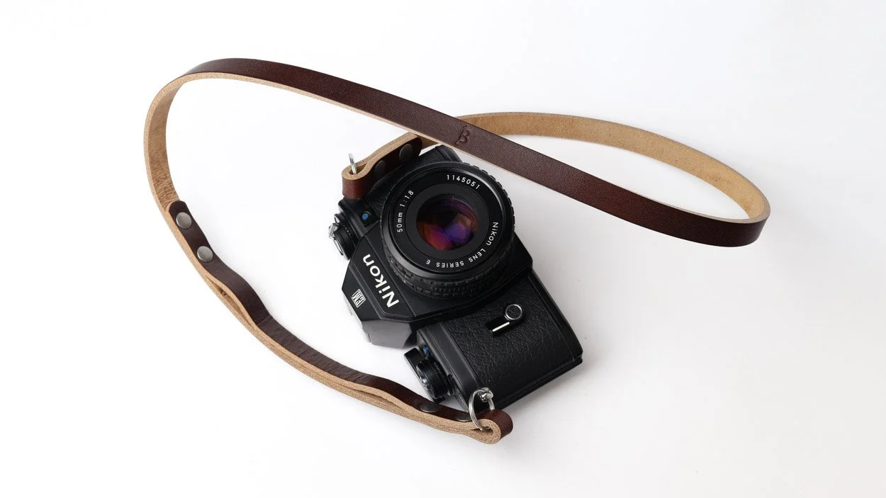 Bowman leather Peak Duo strap with Nikon EM Camera