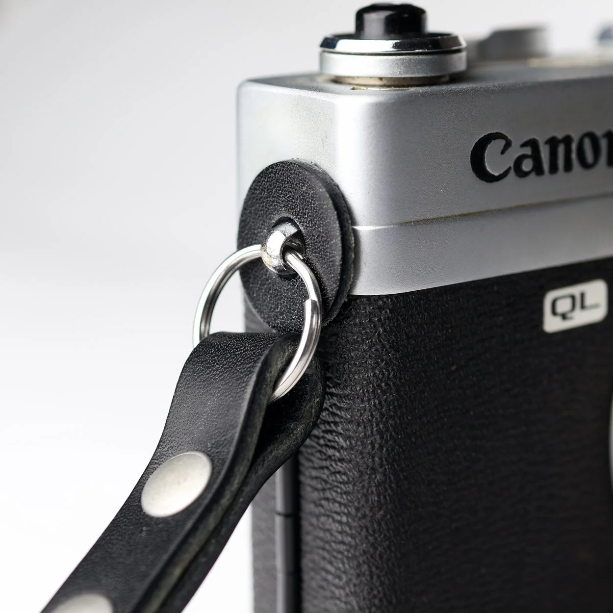 black leather camera strap lug protectors