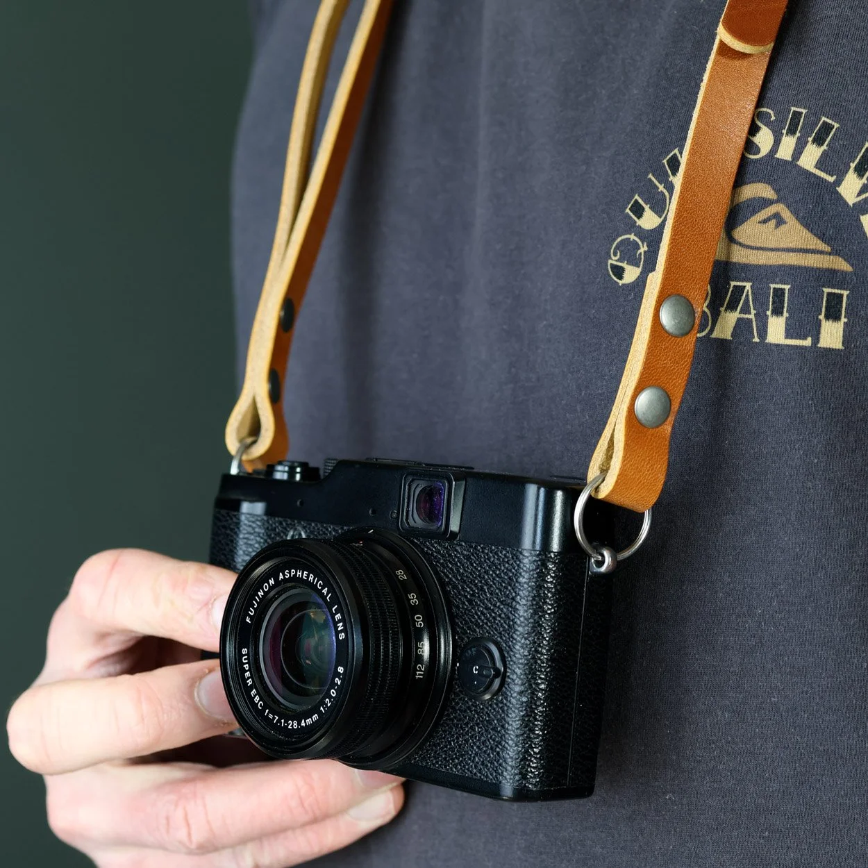 Summit camera strap whiskey close-up with Fujifilm camera