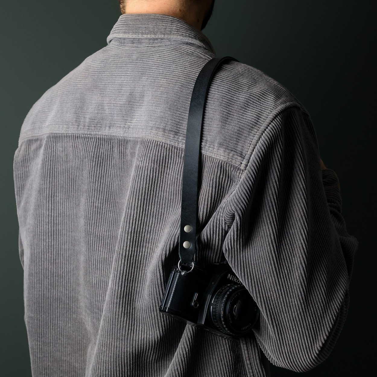 Short black leather camera strap shoulder