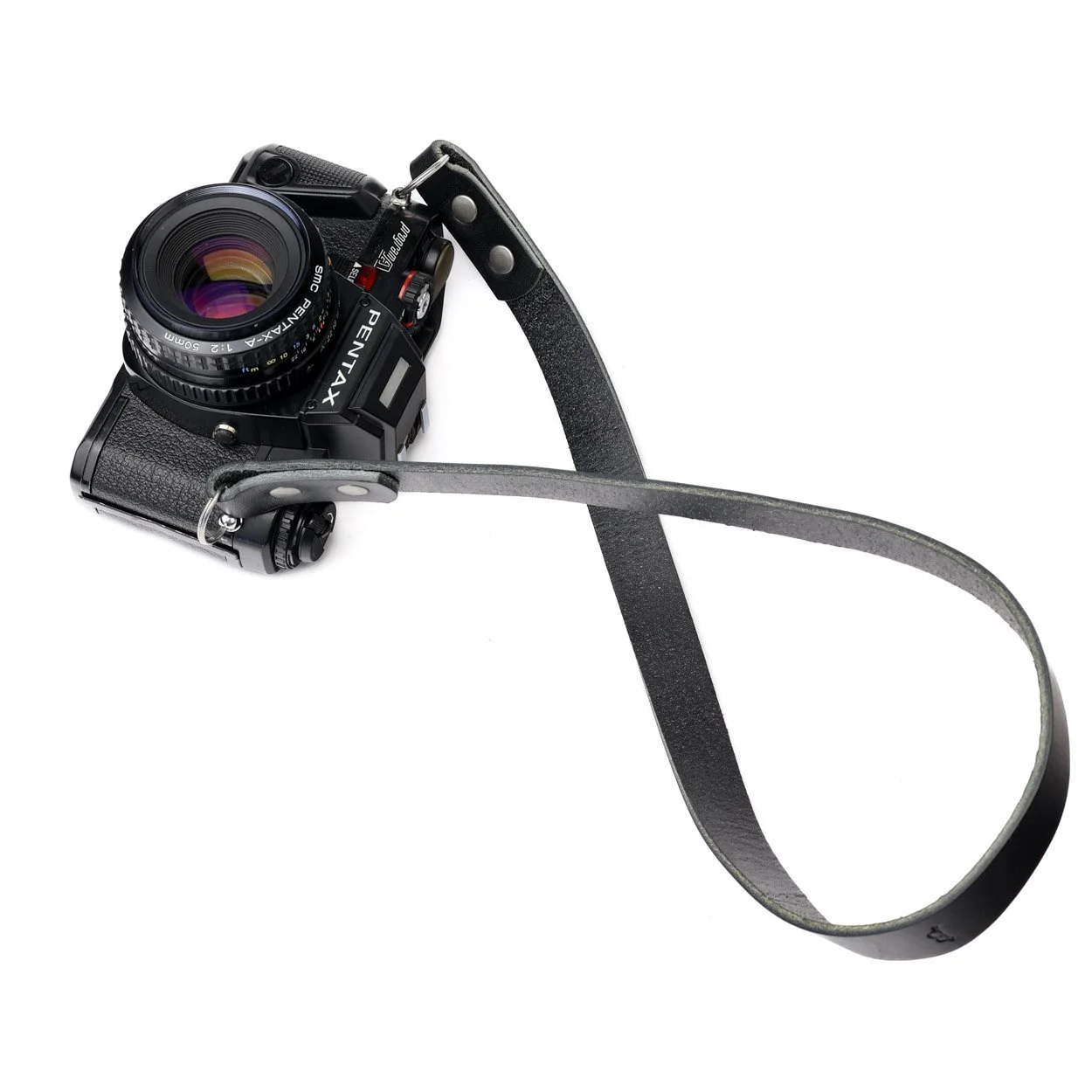 Ridge black leather camera strap on a vintage pentax