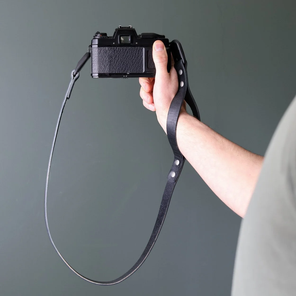 vantage quick release leather camera strap with peak design anchors. Used here is wrist strap form on a vintage Nikon 35mm film camera