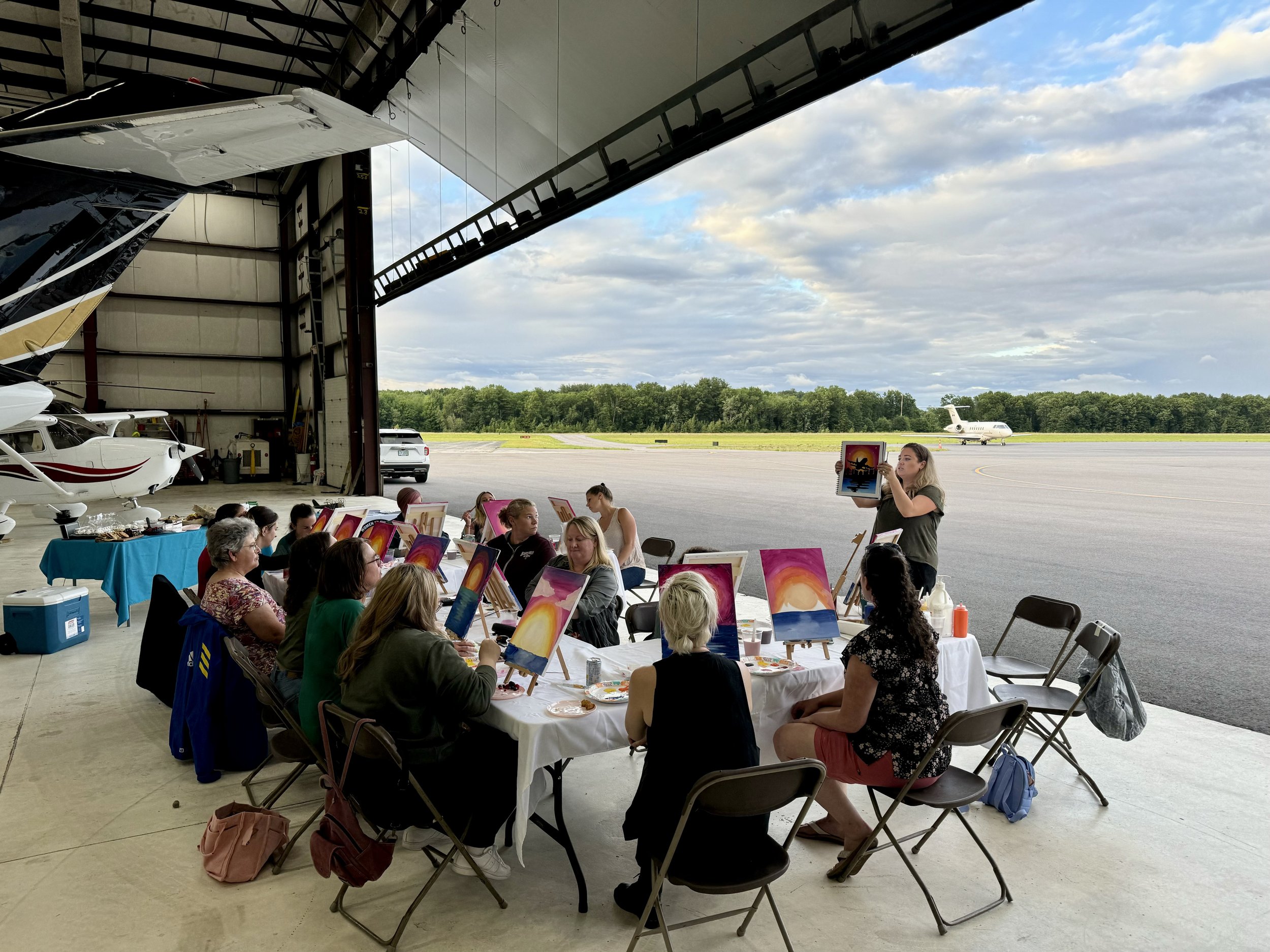 We brought our chapter's logo to life on canvas during our guided, aviation-themed paint night in the hangar of Infinity Aviation.