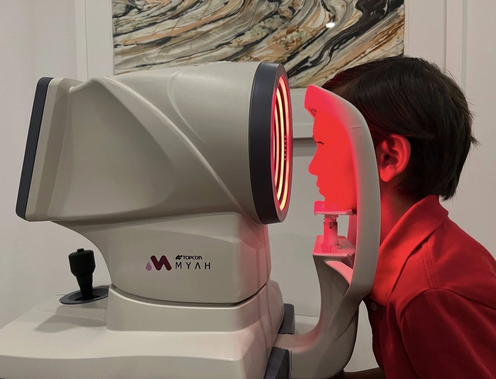 Photo of child having axial length measurement at Insight Eye Care