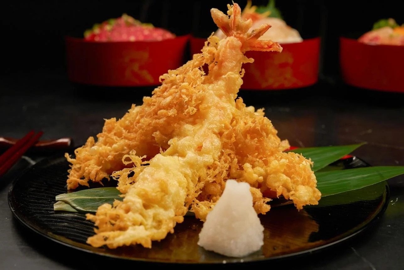 Crispy shrimp tempura with light golden batter served with dipping sauce at Umami Ashland Japanese restaurant