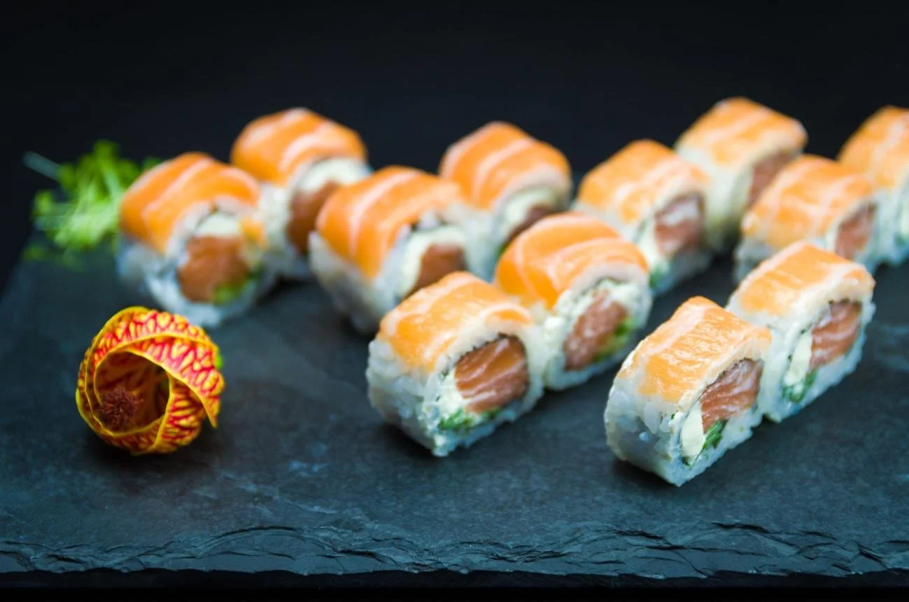 Umami Roll signature sushi with tuna, salmon, basil, tobiko and spicy chili lime sauce at Umami Ashland Japanese restaurant
