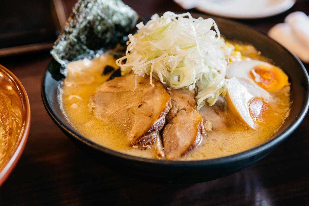Tonkotsu ramen bowl with pork broth, chashu pork, marinated egg, corn and scallions at Umami Ashland Japanese restaurant