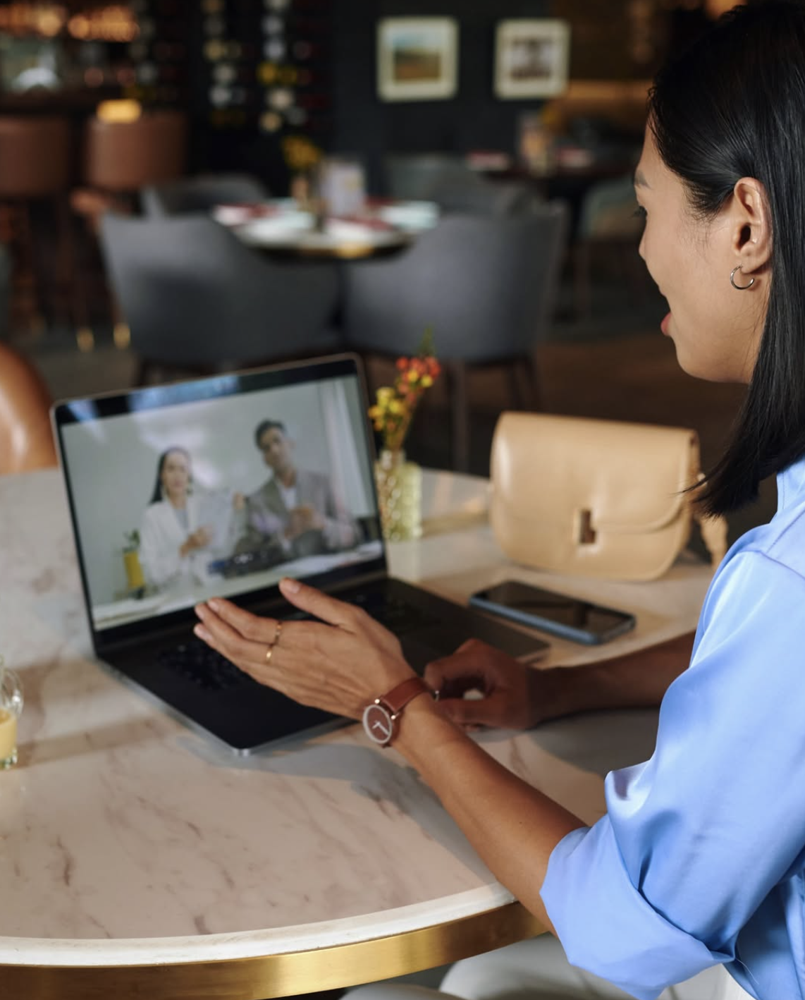 person using laptop on a virtual meeting