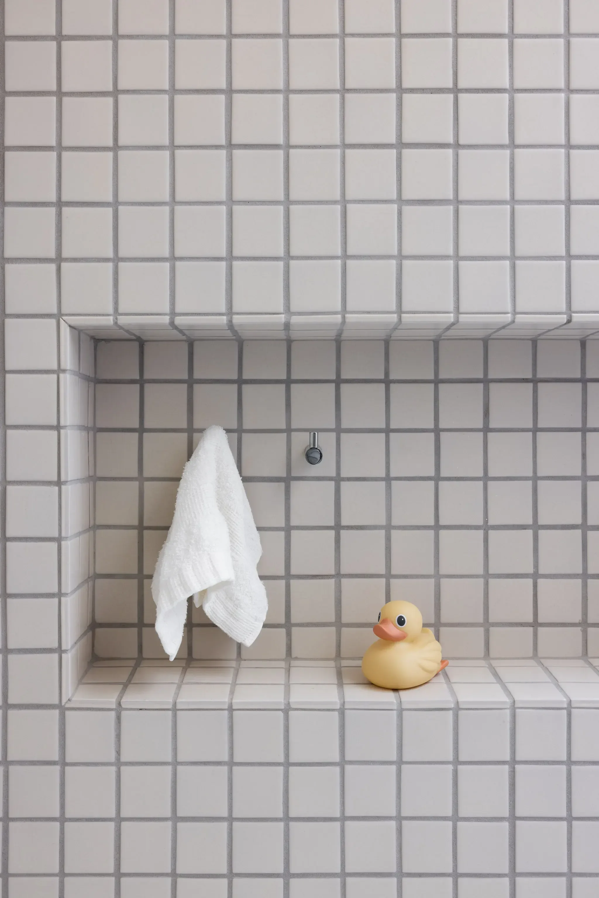 white-mosaic-tile-shower-niche-studio-vae-bathroom-design.webp