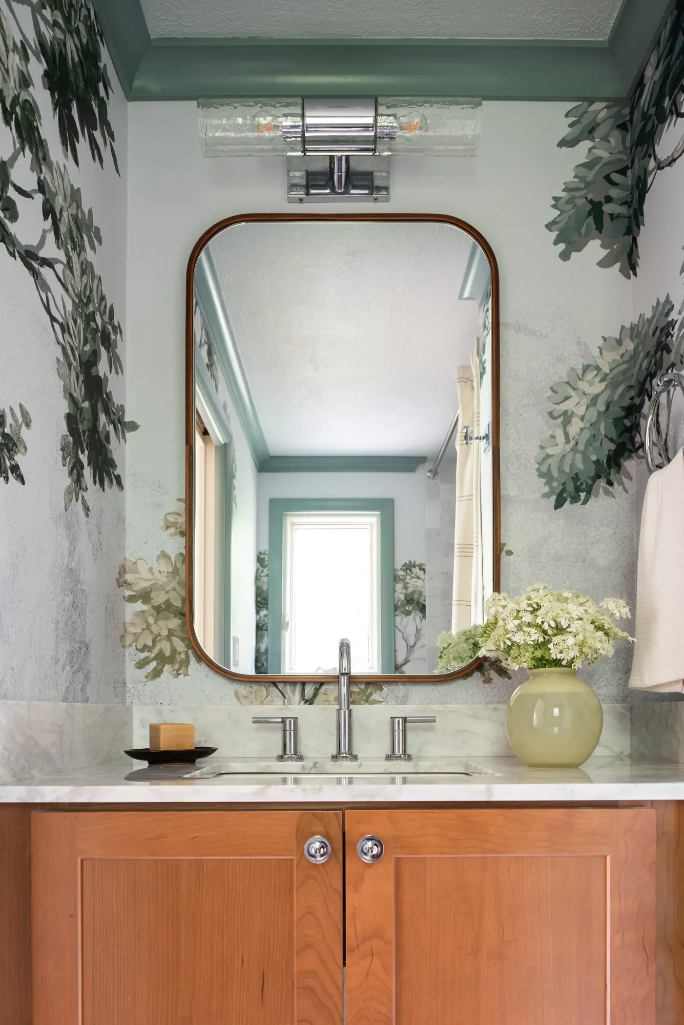primary-bath-walnut-vanity-arched-mirror-tree-wallpaper-oberlin-studio-vae-san-francisco.webp