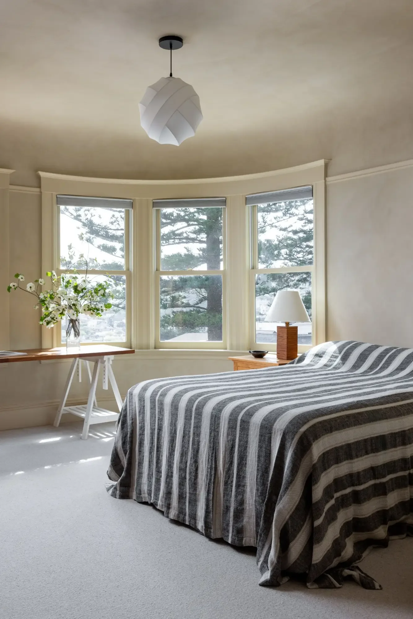 Guest bedroom with bay window designed by Studio VAE San Francisco interior designers