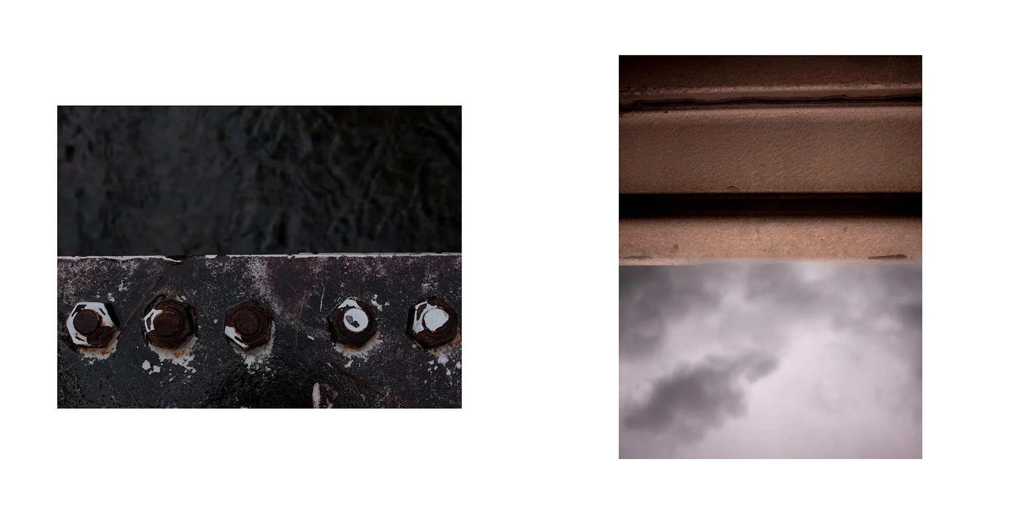 Close-up of rusted industrial bolts on weathered metal surface and a layered brown cardboard material with a cloudy sky in the background.
