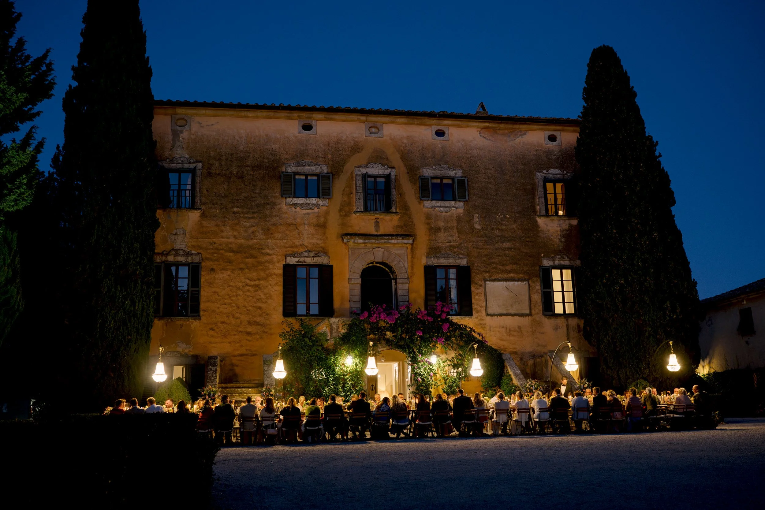 Villa di Ulignano wedding venue in Tuscany, drone view at sunset showing the villa, gardens, pool, and surrounding countryside