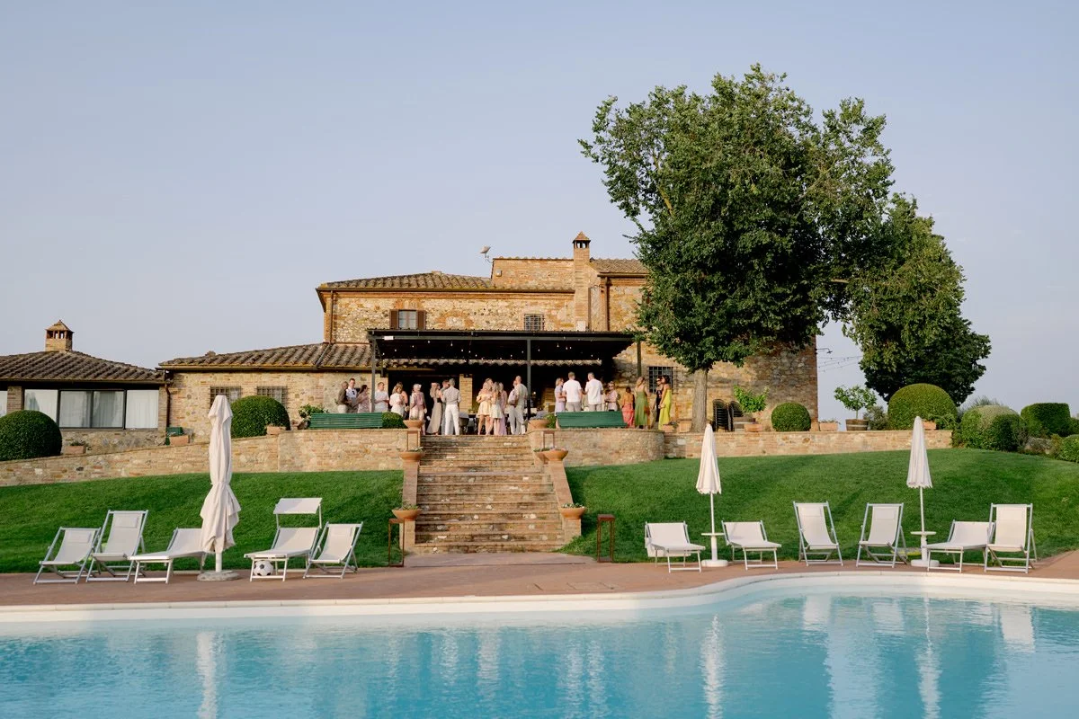 View of Villa Boscarello and the swimming pool during the welcome pizza dinner celebration.