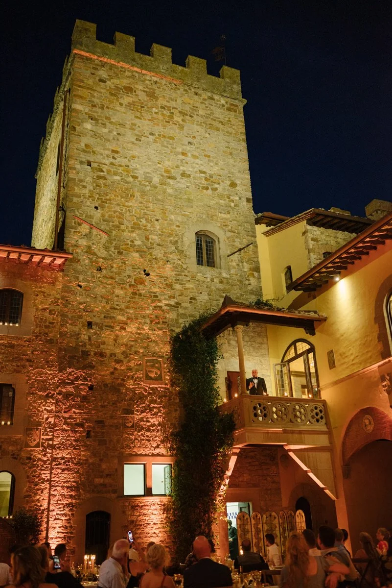 Opera singer performing on the terrace during a wedding celebration at Castello Il Palagio.