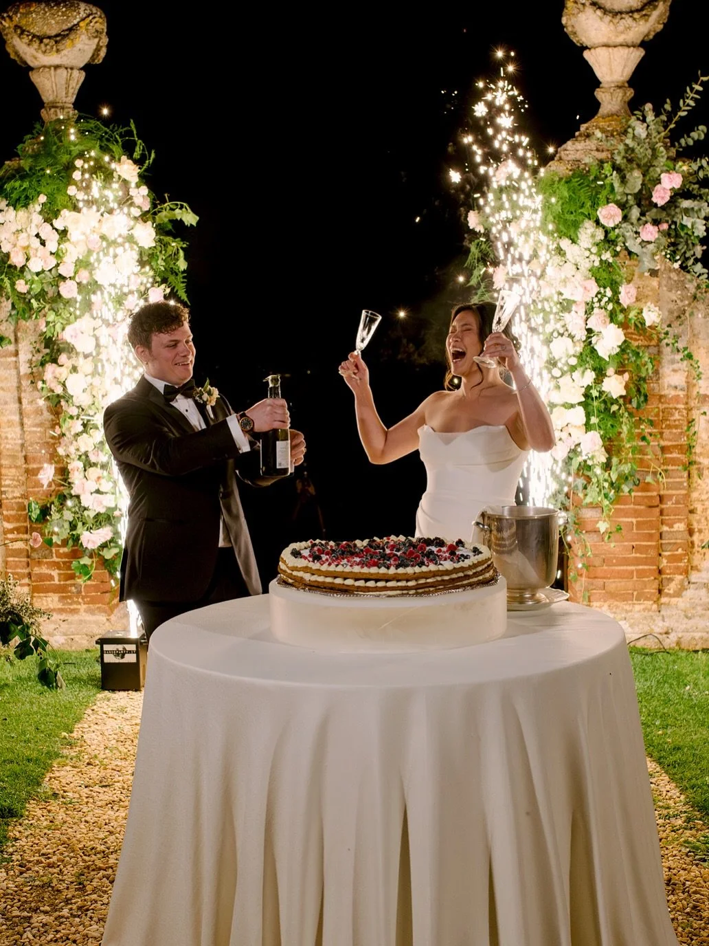 Celebrating in true Italian style at Castello di Celsa 🥂✨ First the happiest cheers as the couple popped a bottle of prosecco, golden sparklers lighting the night. Then the sweetest finale &mdash; a traditional millefoglie wedding cake, layered with