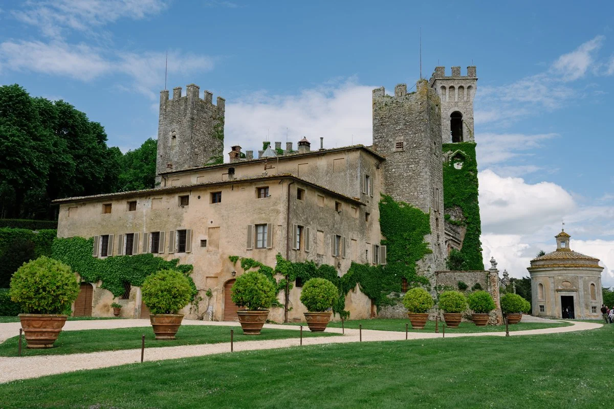 Castello di Celsa wedding venue in Tuscany photographed from the courtyard, showing the historic stone castle exterior.