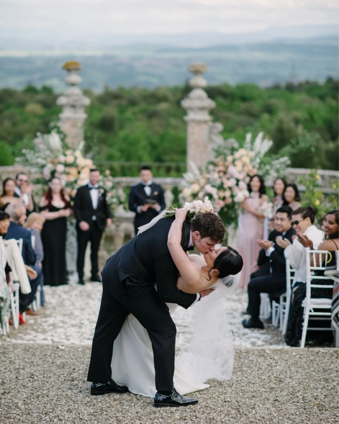 A just-married kiss at Castello di Celsa, right in the middle of everyone who made the moment real.

No staging. No direction. Just that split second after the ceremony when everything slows down and it finally sinks in.

From the walk down the aisle
