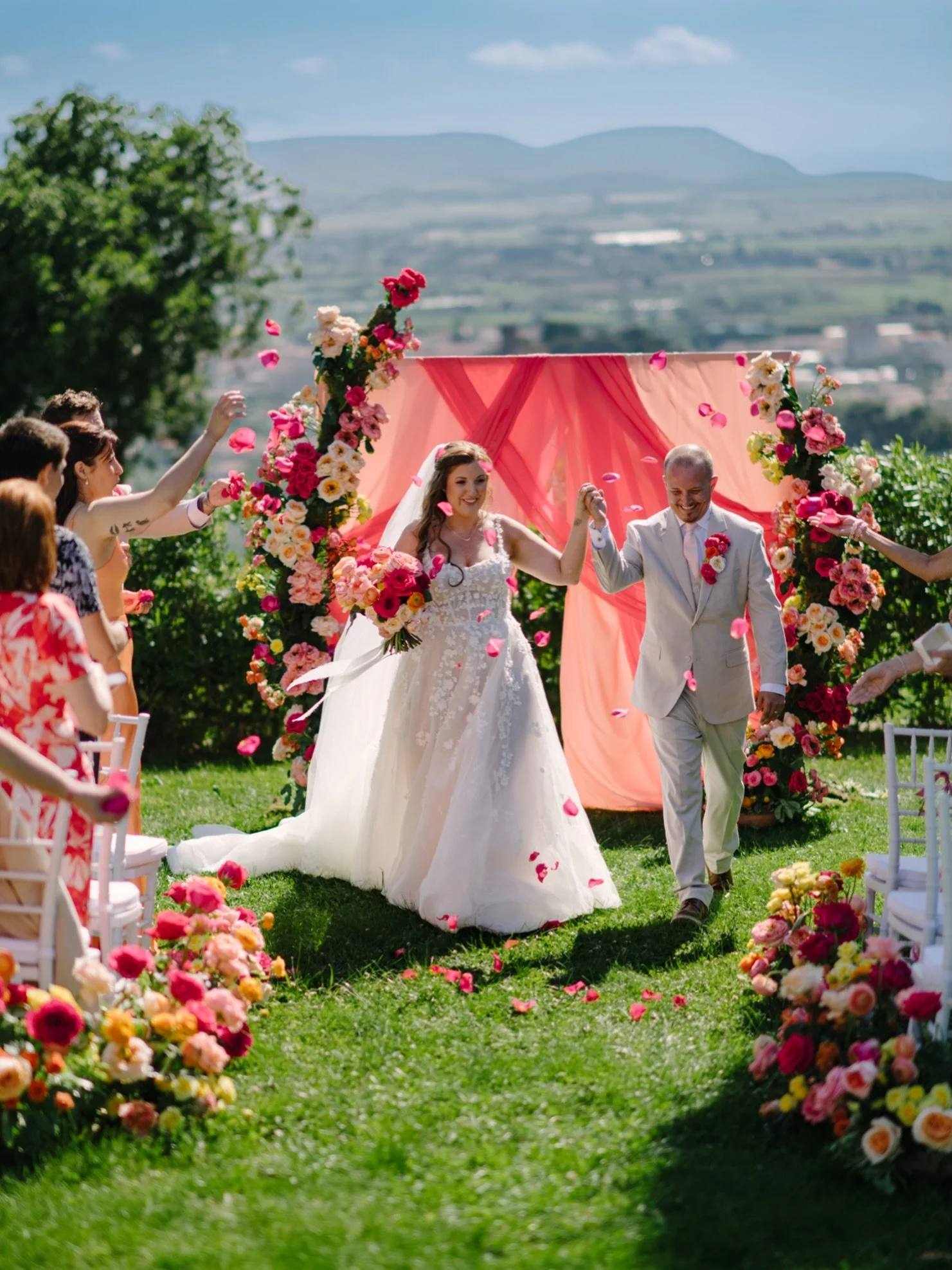 A bold-color Tuscany wedding at Castello Bonaria and a recessional I&rsquo;ll remember for years.
 
This is what I love about being a destination wedding photographer in Tuscany: couples who fly all the way to Italy and then actually commit to a visi