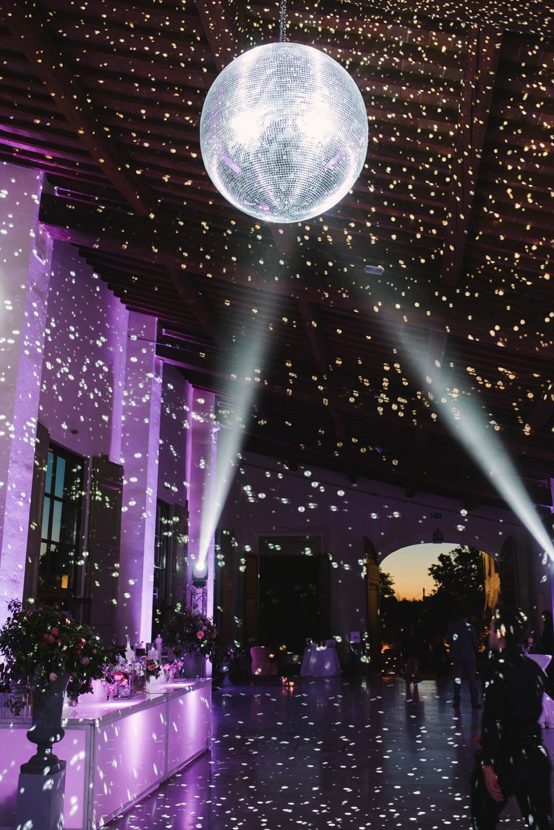 Disco ball hanging in the main party room at Villa Medicea di Lilliano during the wedding celebration