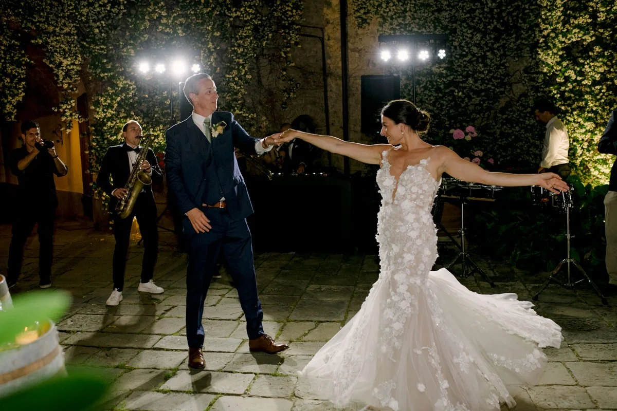 Bride and groom sharing their first dance at Castello di Bossi wedding venue in Tuscany.