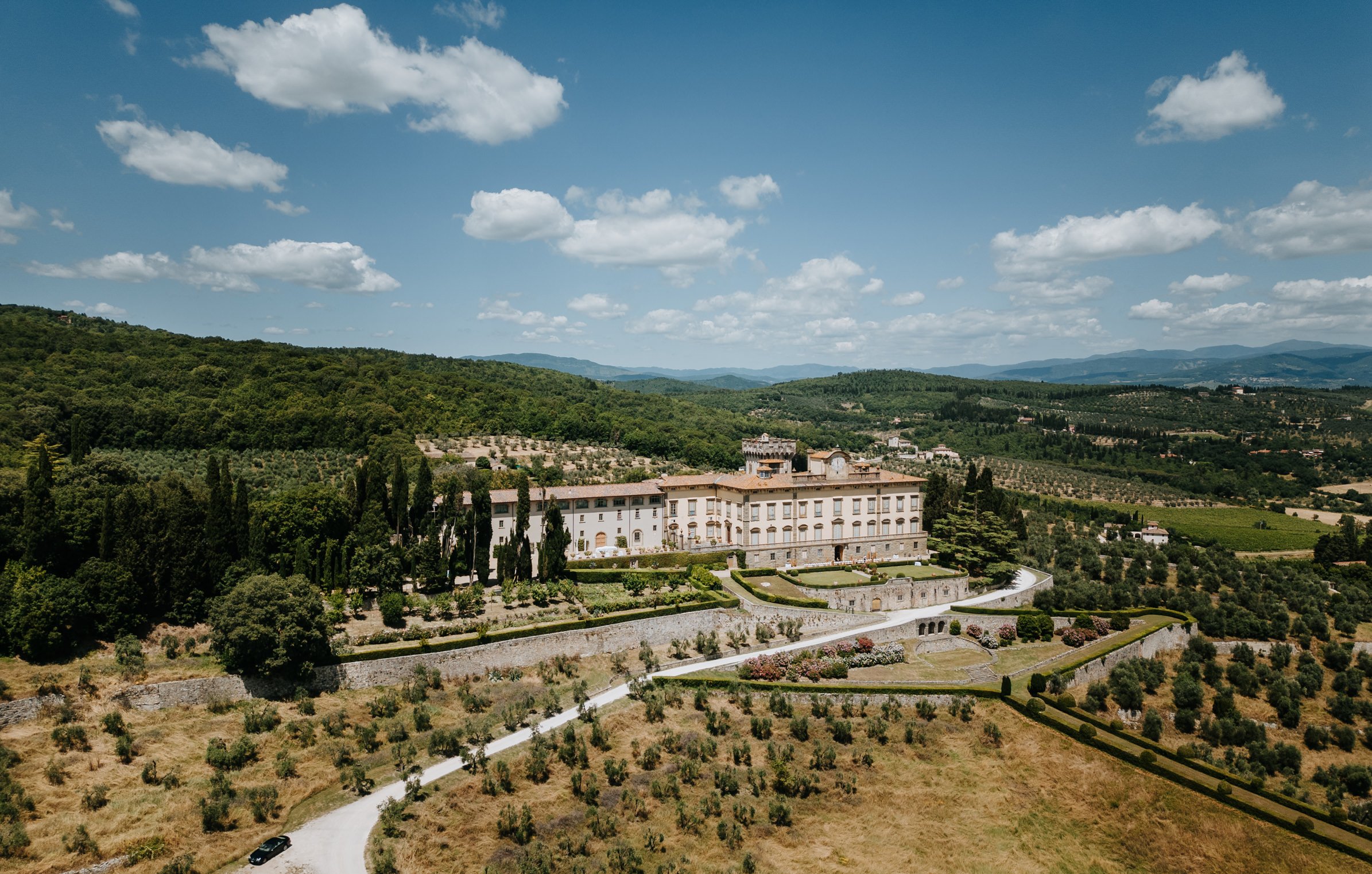 Torre a Cona wedding venue in Tuscany seen from above, showing the villa estate, vineyards, and surrounding countryside near Florence.