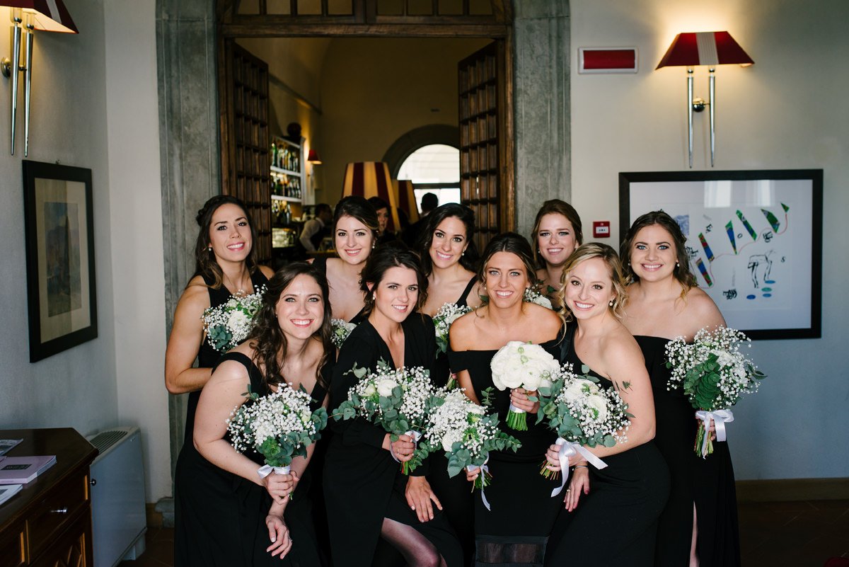 Bridesmaids holding their bouquets after ceremony at Villa Hotel Tolomei in Tuscany.