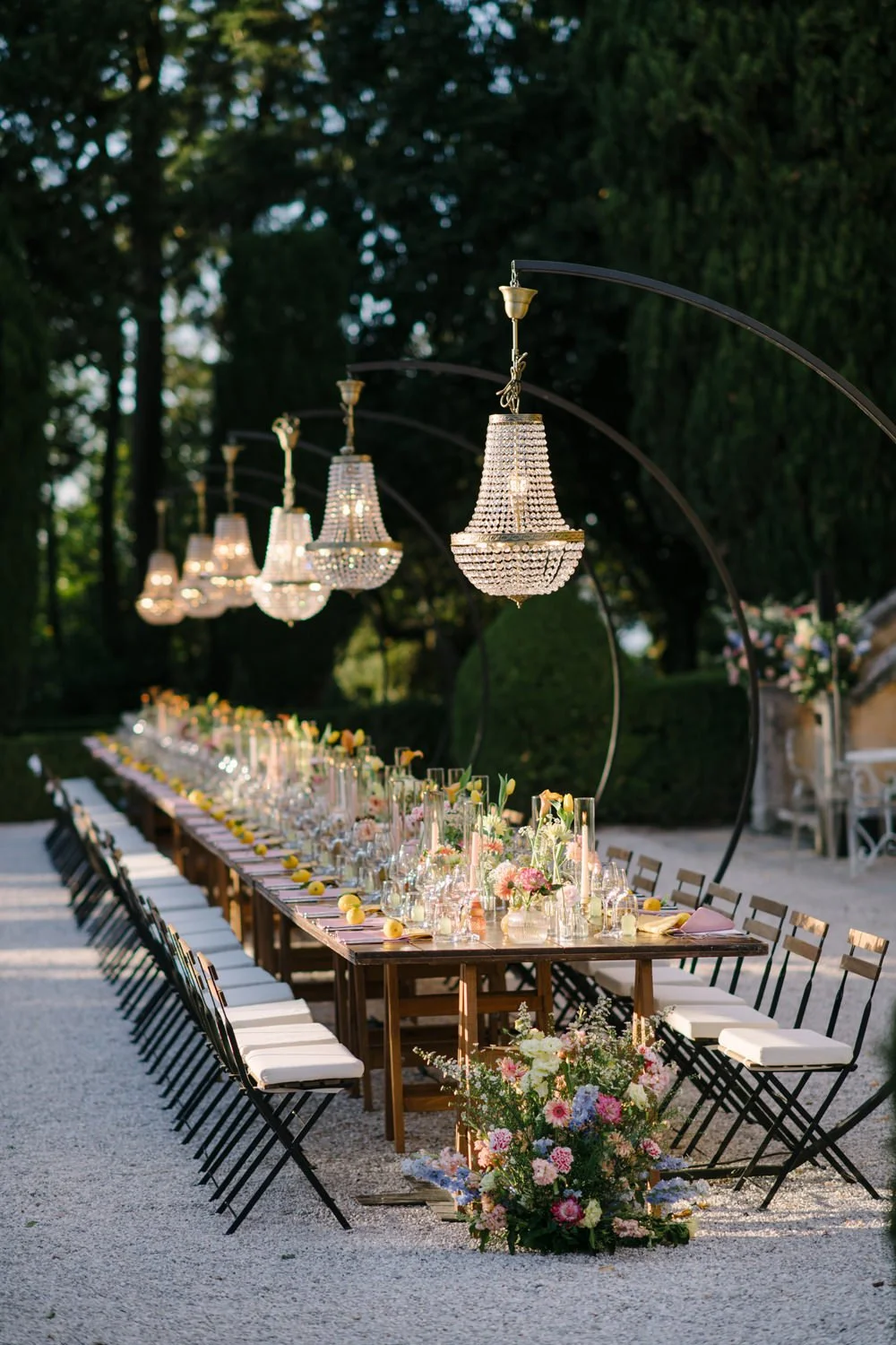 Wedding table styling with garden flowers, candles and crystal chandeliers at Villa di Ulignano, by FunkyBird