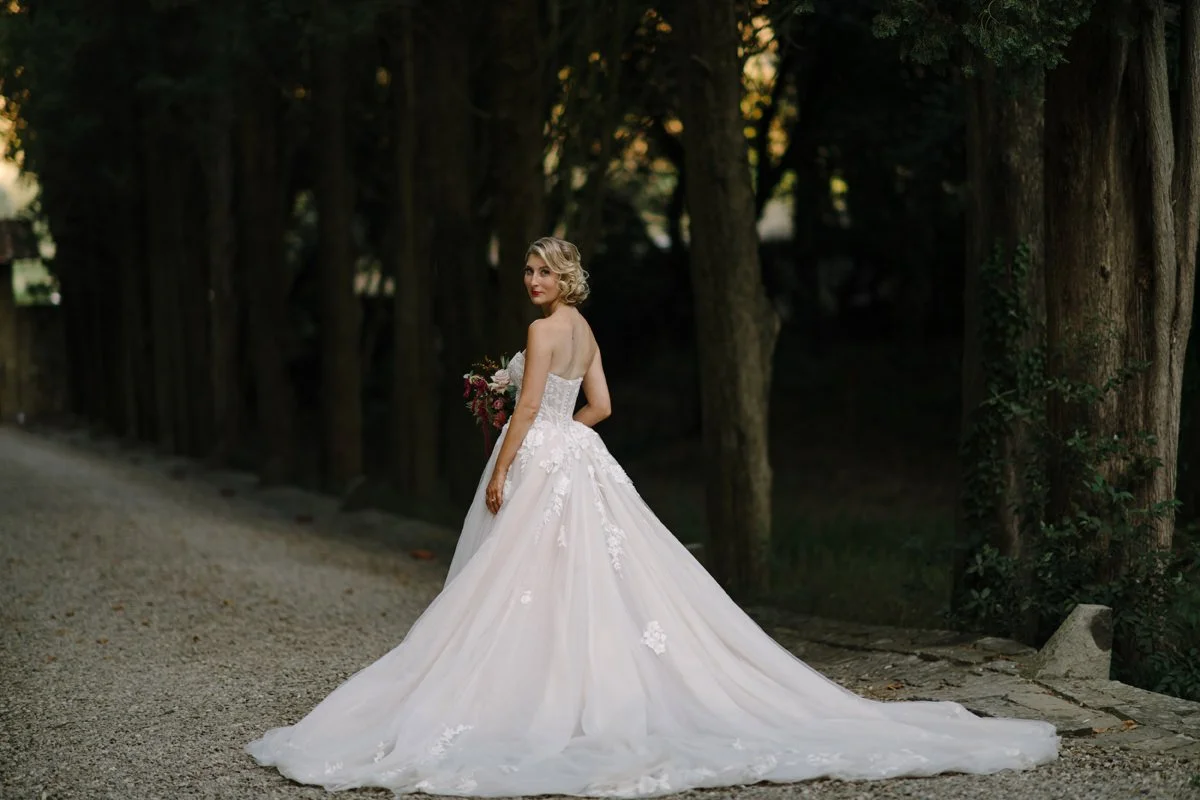 Bride posing in her wedding dress at Castello il Palagio wedding.
