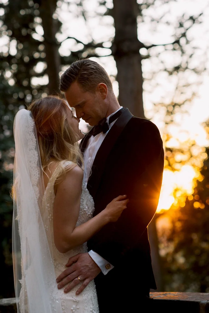 Close portrait of the wedding couple looking at each other during golden hour at Castello di Montegufoni.