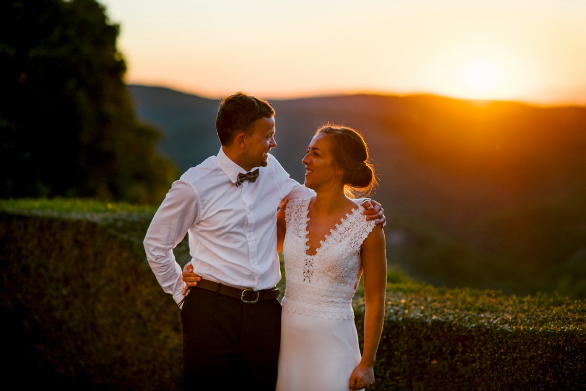 Bride and groom looking at each other during sunset portraits at Borgo Pietrafitta in Tuscany.