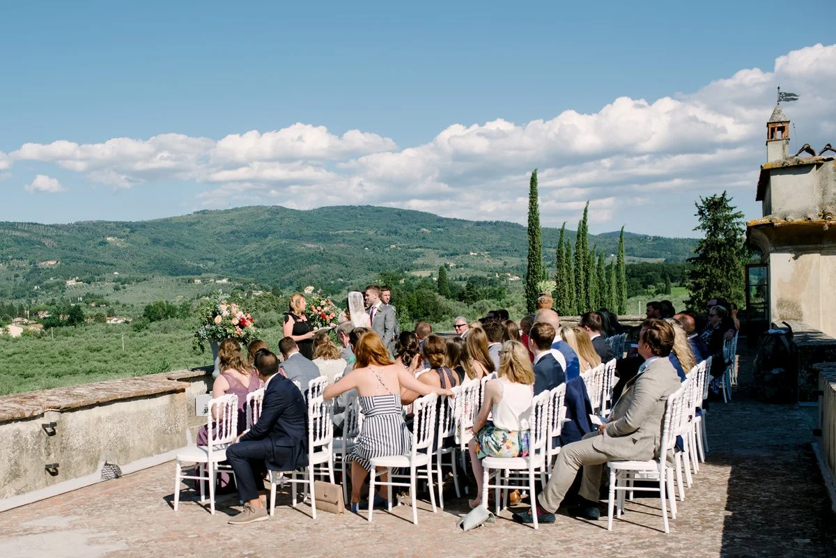 Wedding ceremony with guests on the terrace of Villa Medicea di Lilliano overlooking the Tuscan countryside