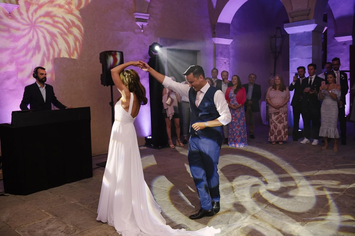 Wedding couple sharing their first dance with dramatic lighting at Villa Artimino in Tuscany.