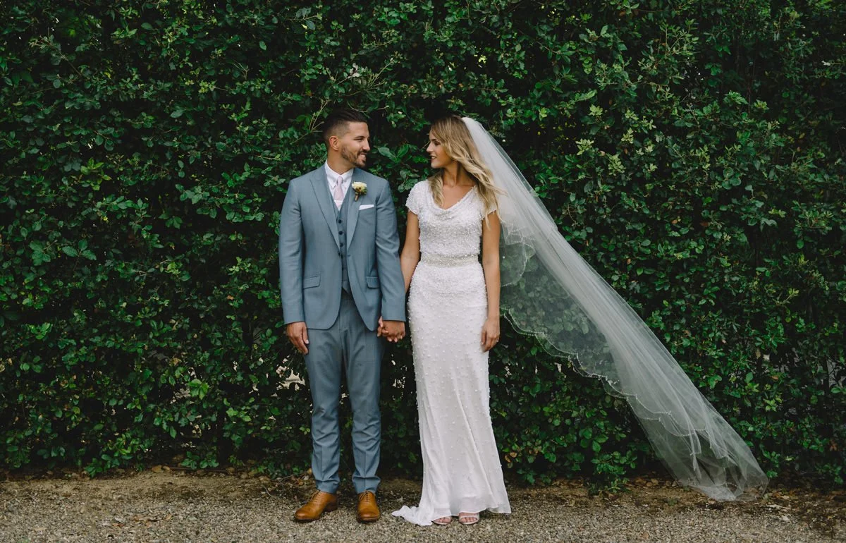Couple sharing a quiet moment in the garden at Villa Cora during their wedding day.