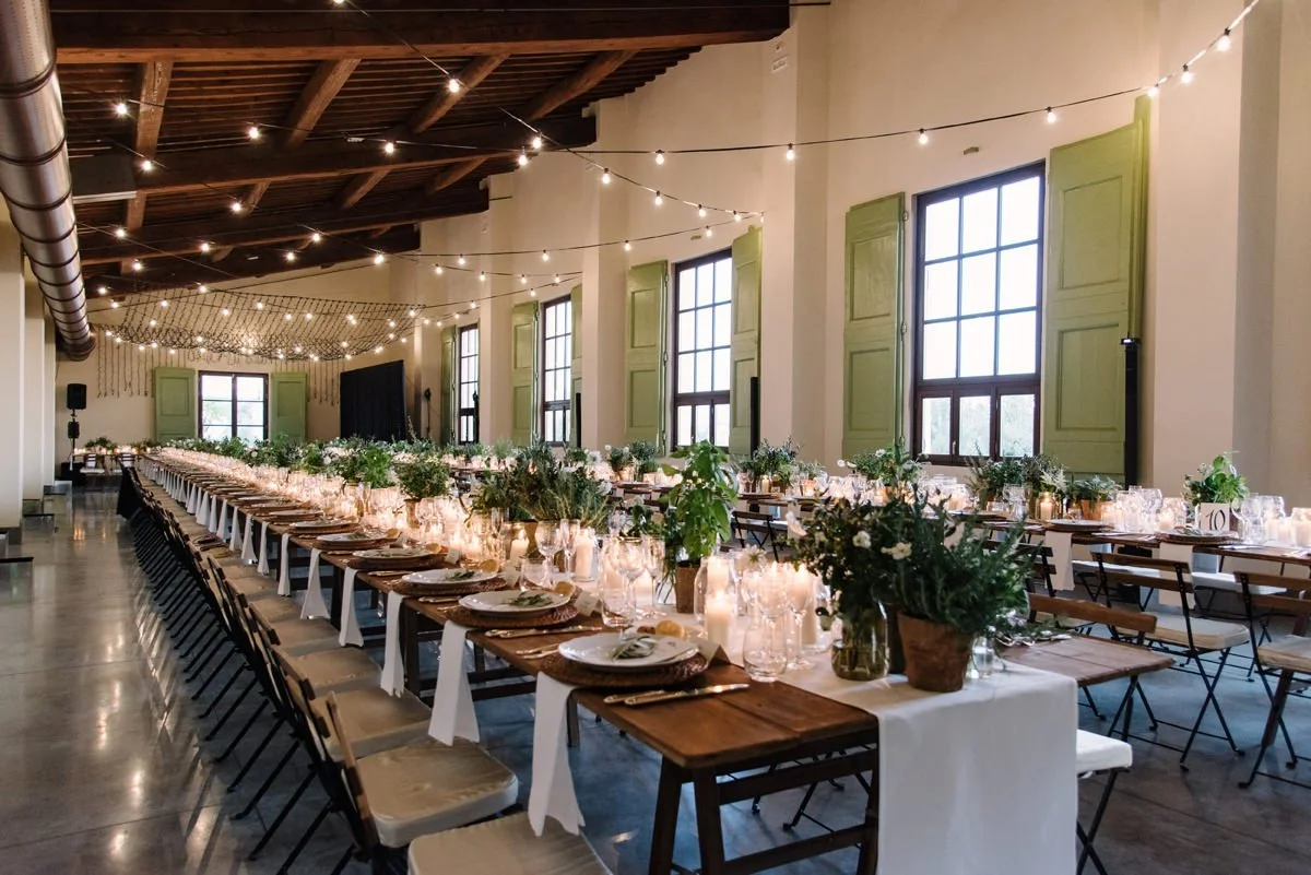 Long wedding dinner tables set inside Villa Medicea di Lilliano