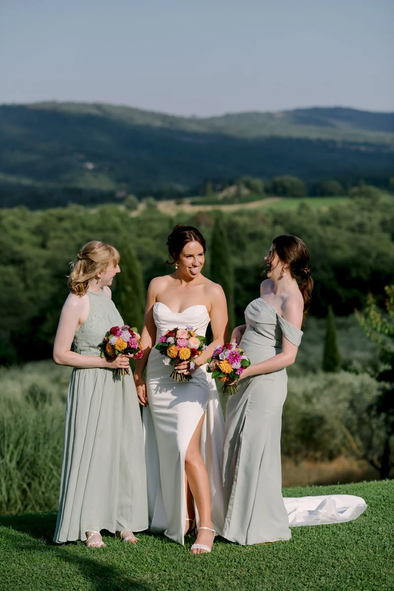 Bride and bridesmaids at Casa Cornacchi with open Tuscan countryside landscape in the background